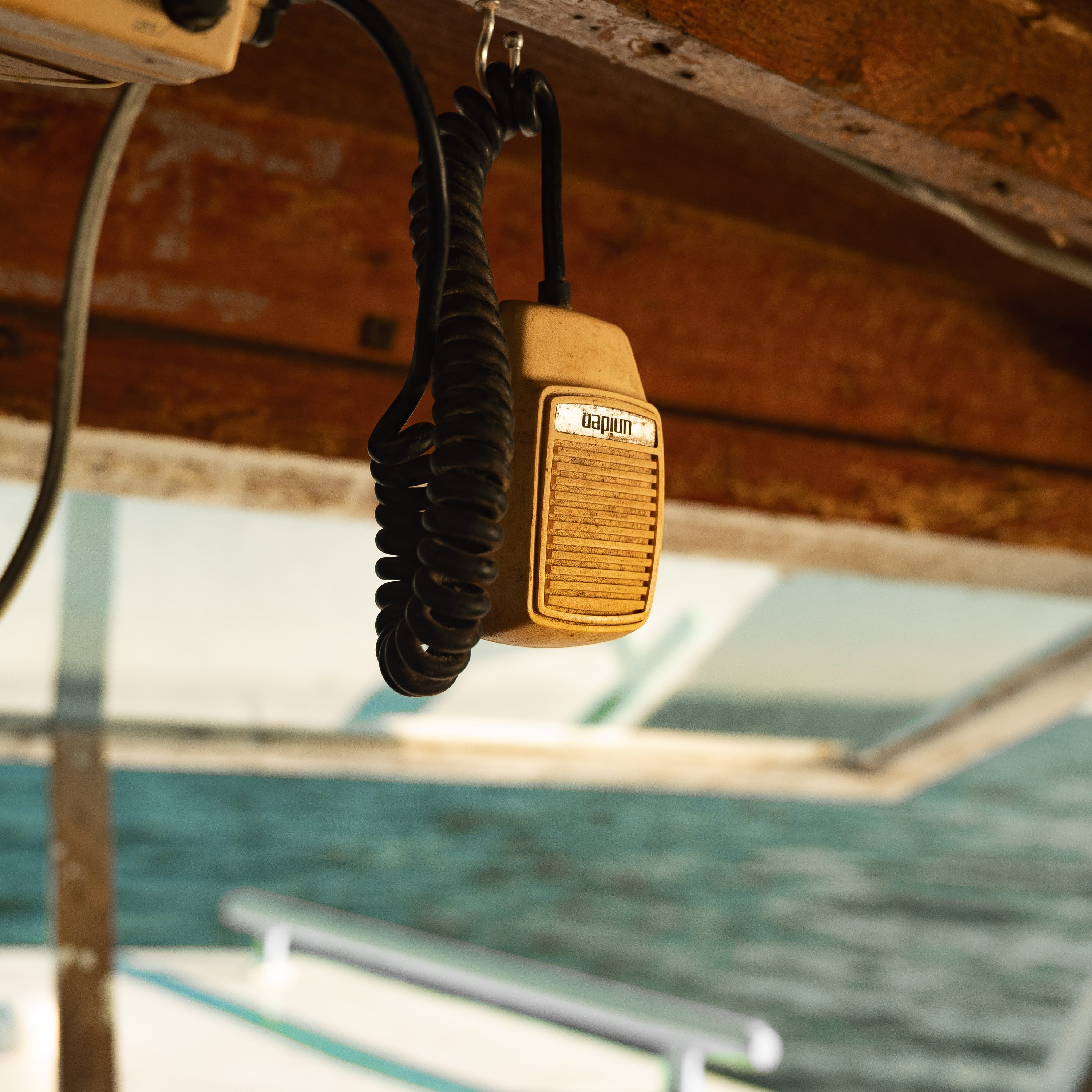 A waterman's hands work a line aboard his boat.