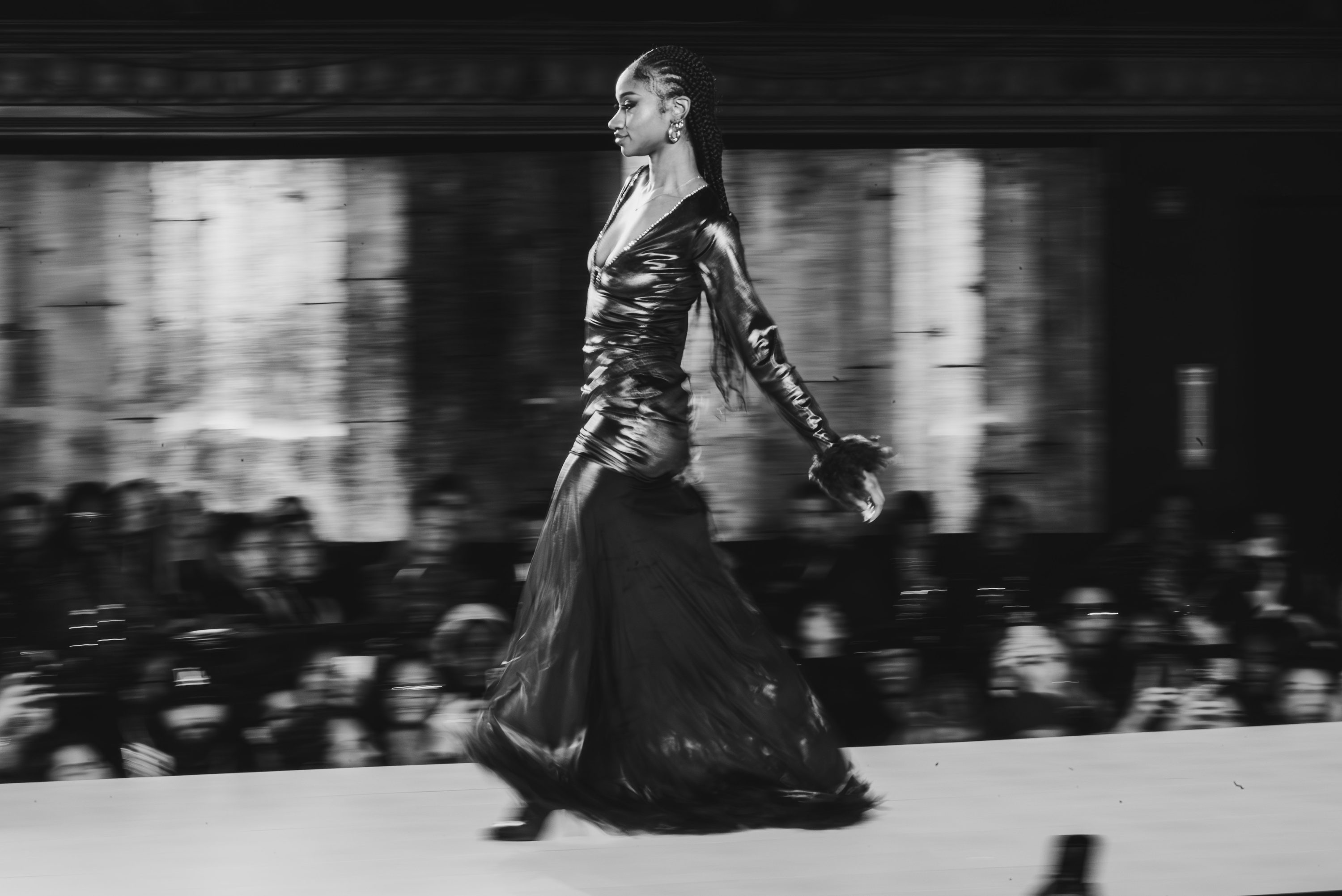 A model pauses at the end of the runway.