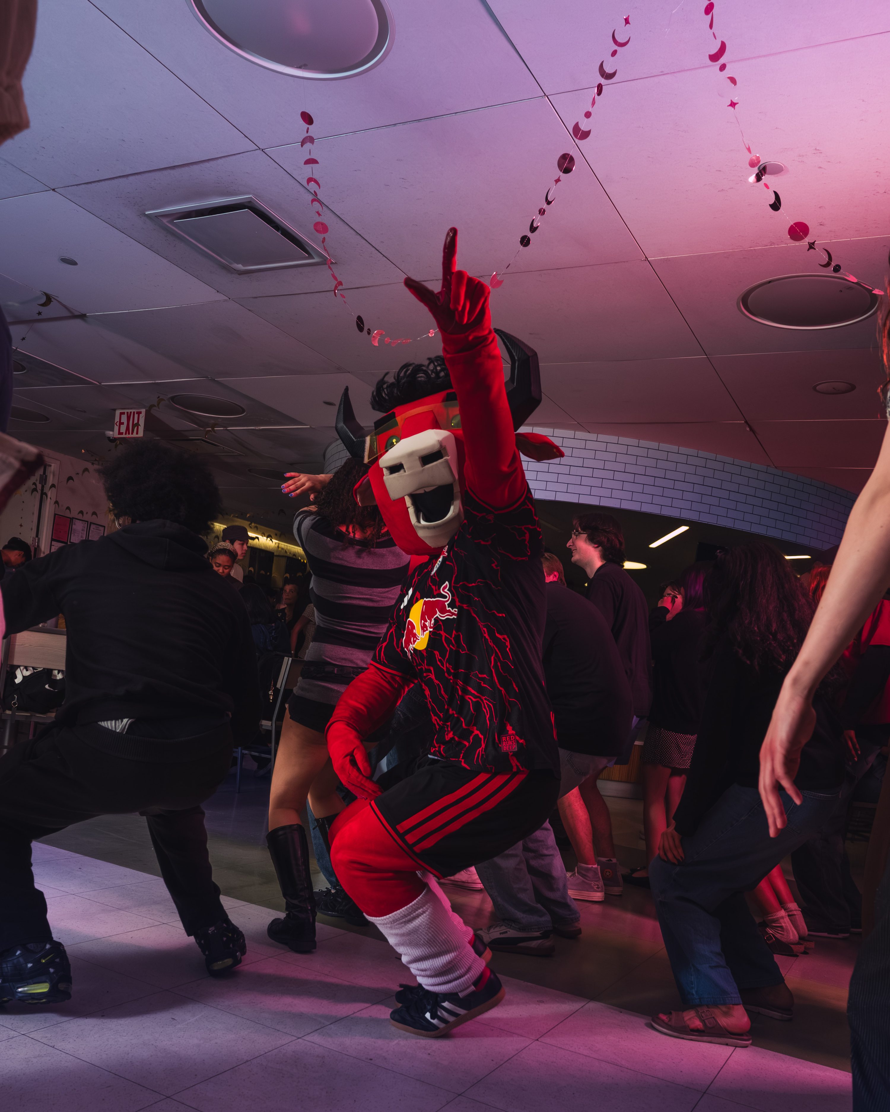A performer commands the stage under event lighting.