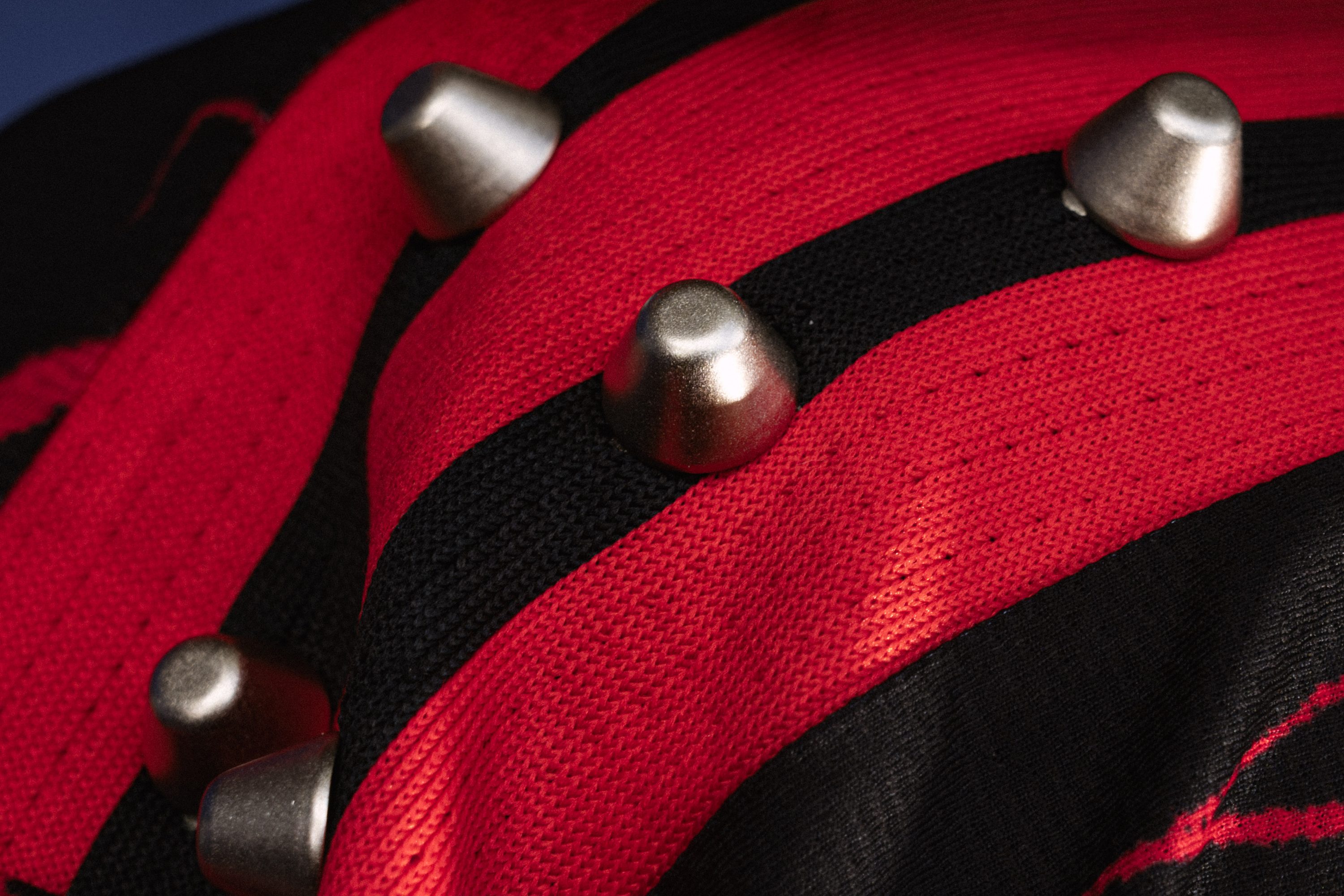 A close detail of a Red Bull jersey's fabric and crest.