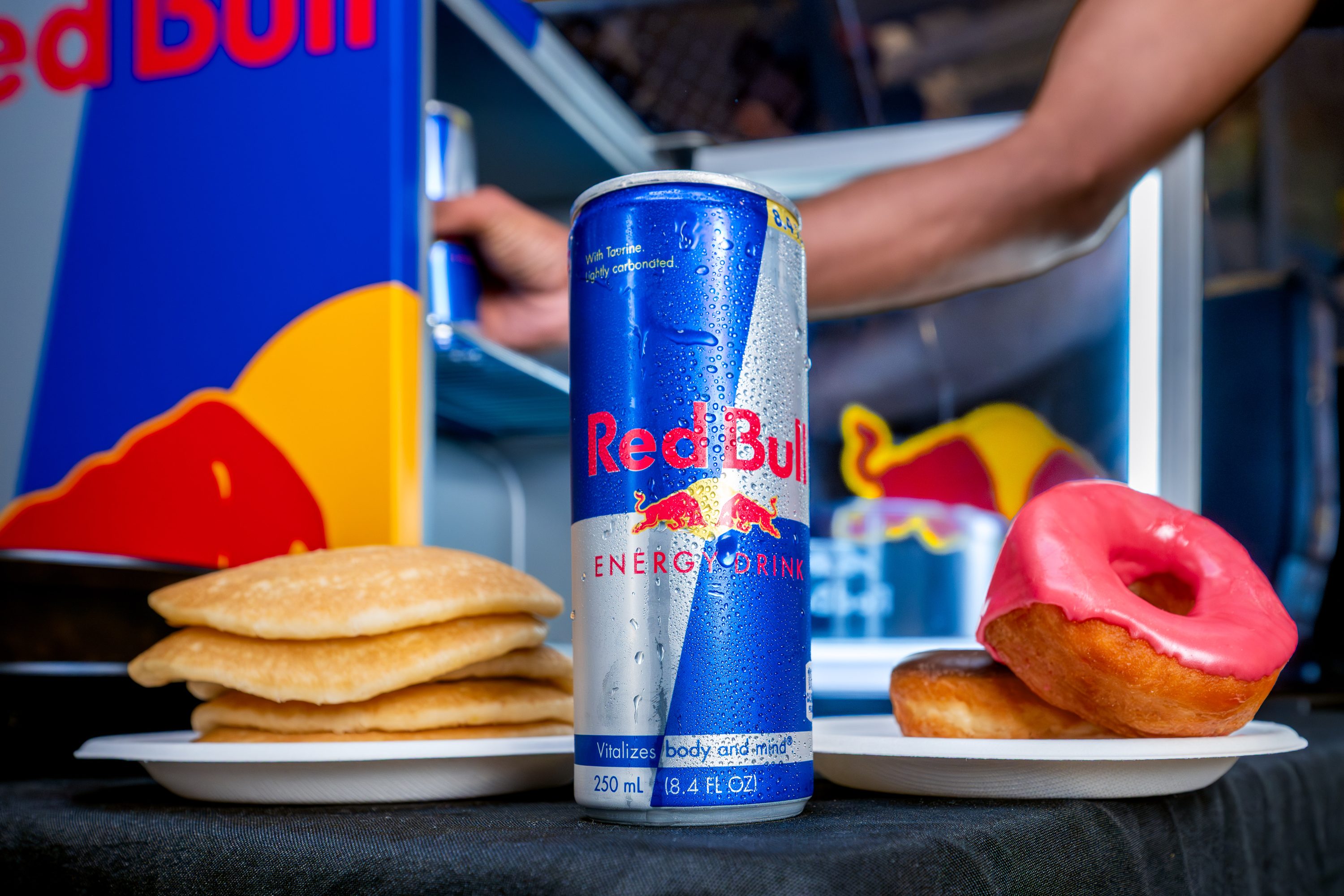 Banners hang over a crowded Red Bull Midnight Breakfast hall.