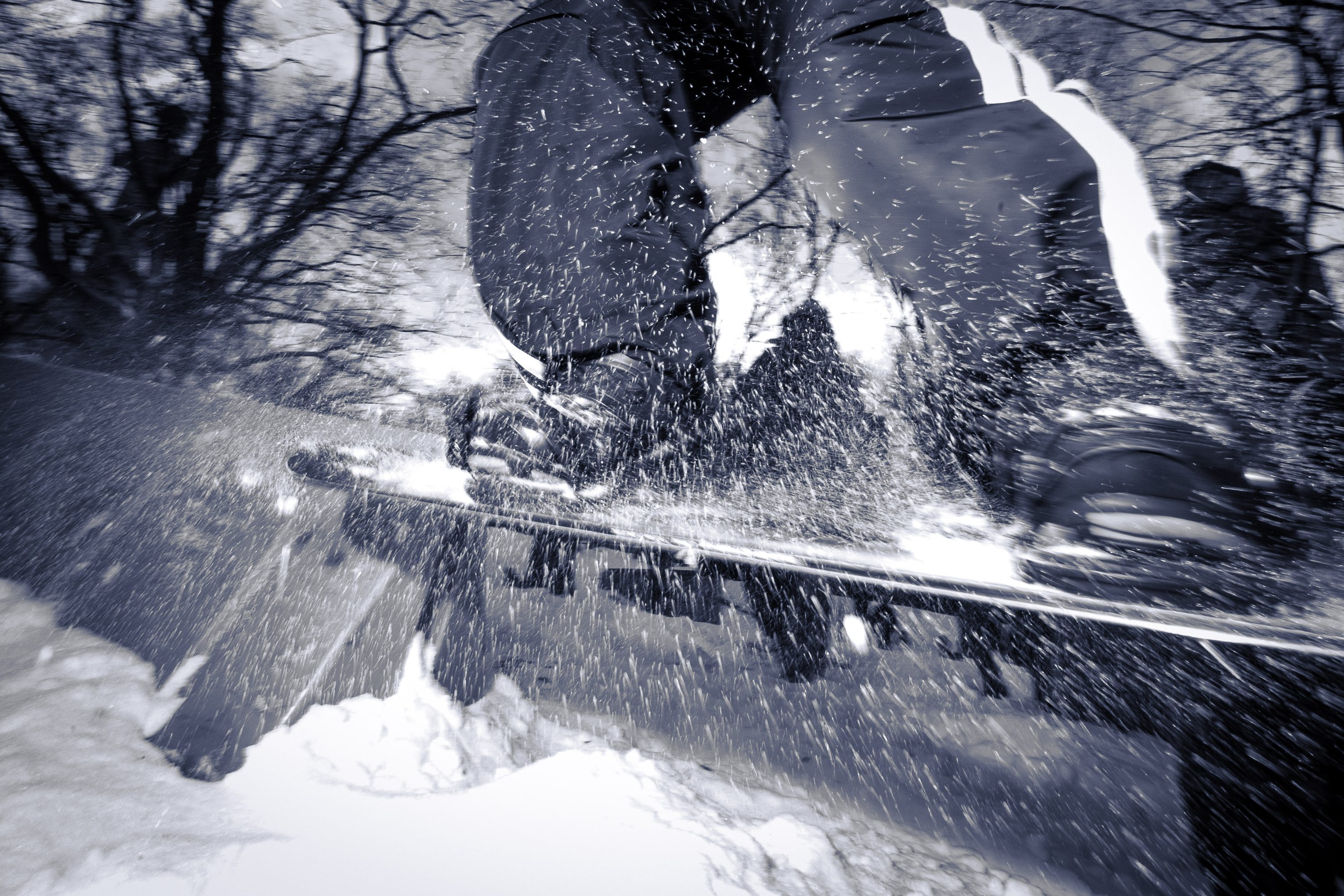A snowboarder floats mid-air through a trick at Snow Jam.